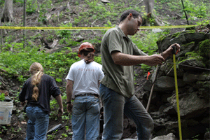 Patrick & Graham finish up thier unit at the Blast Furnace as Cameron takes a measurement near the casting arch.